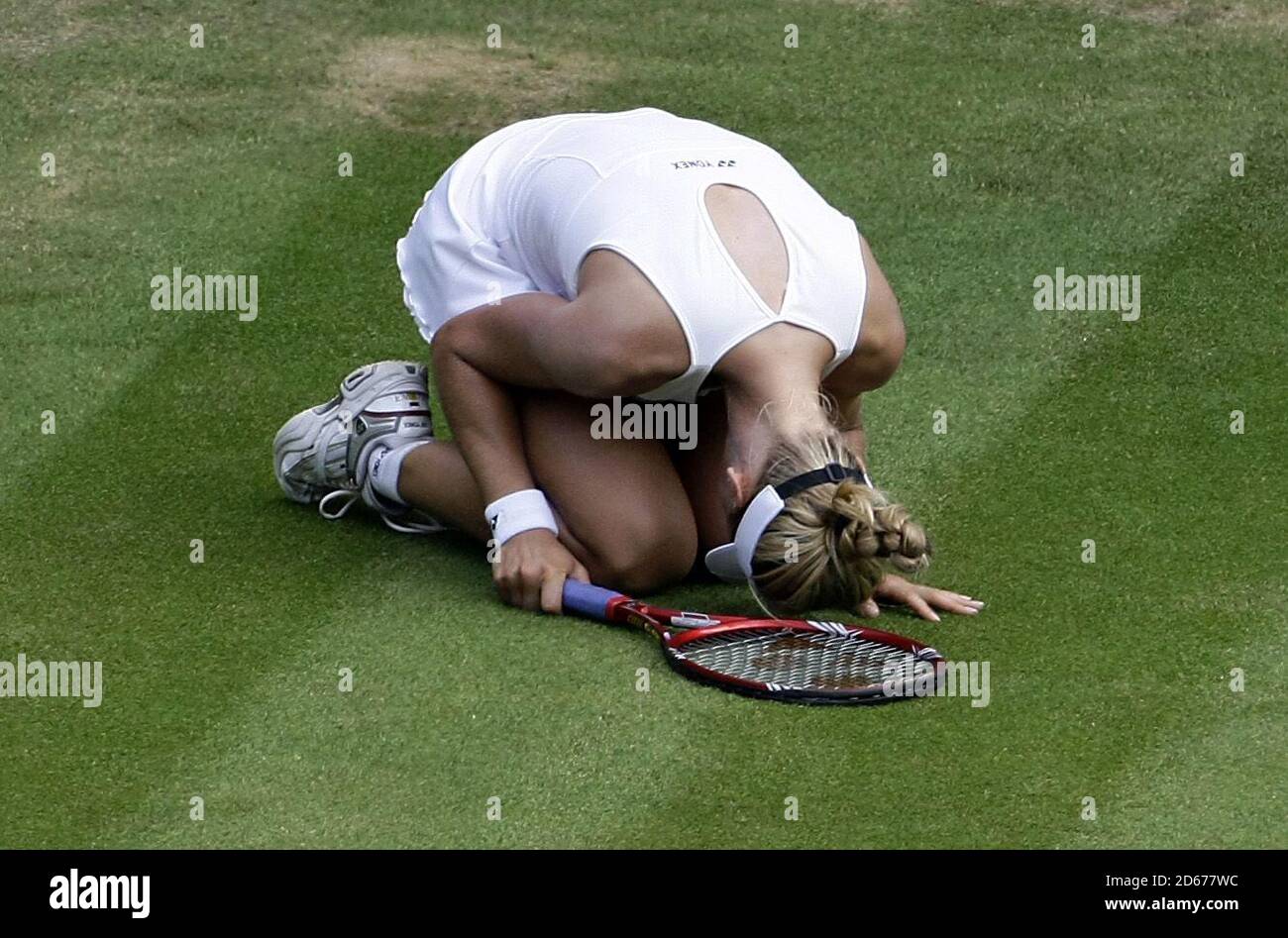 Russia's Elena Dementieva ends up on the floor during her match against USA's Serena Williams Stock Photo