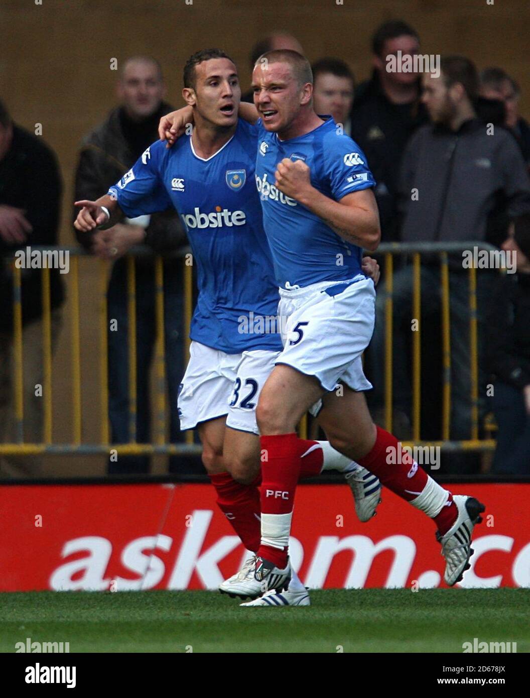 Portsmouth's Hassan Yebda (left) celebrates scoring the opening goal with teeam mate Jamie O'Hara (right). Stock Photo