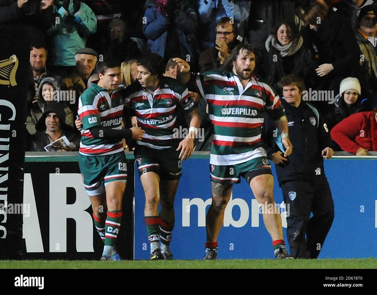 Leicester Tigers' Ben Youngs (left) and Martin Castrogiovanni (right) congratulate Lucas Amorosino (centre) after he score their first try of the game Stock Photo