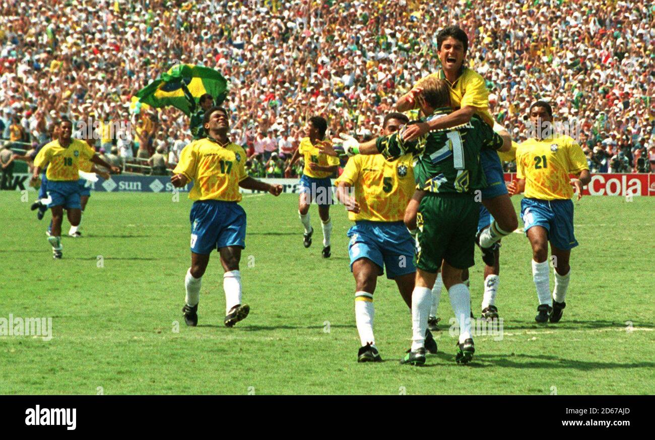 Brazil charge at hero Taffarel after they beat Italy in the penalty shoot out Stock Photo