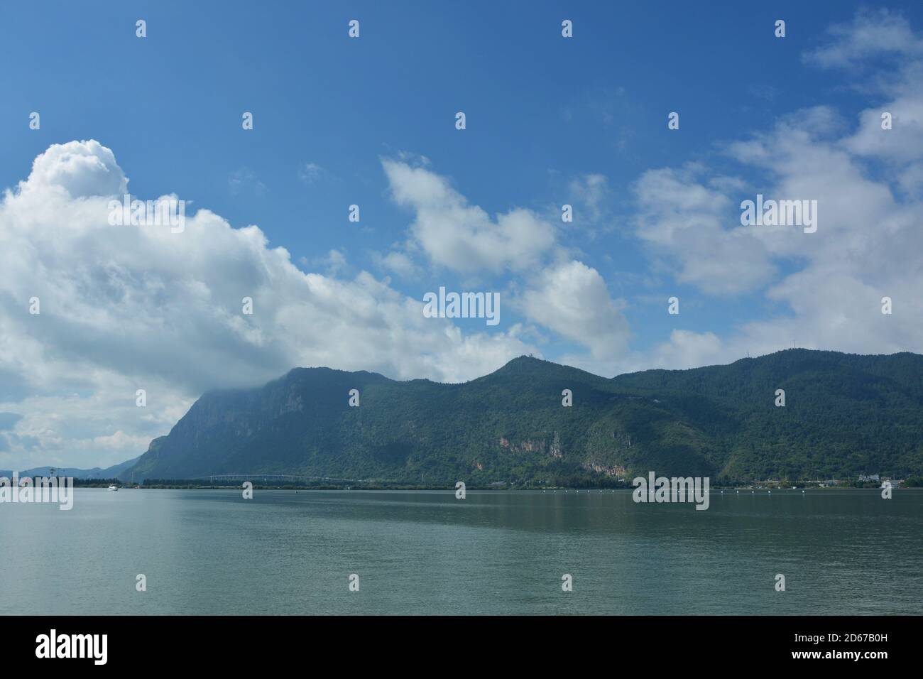 mountain and lake view under blue sky with white clouds Stock Photo - Alamy