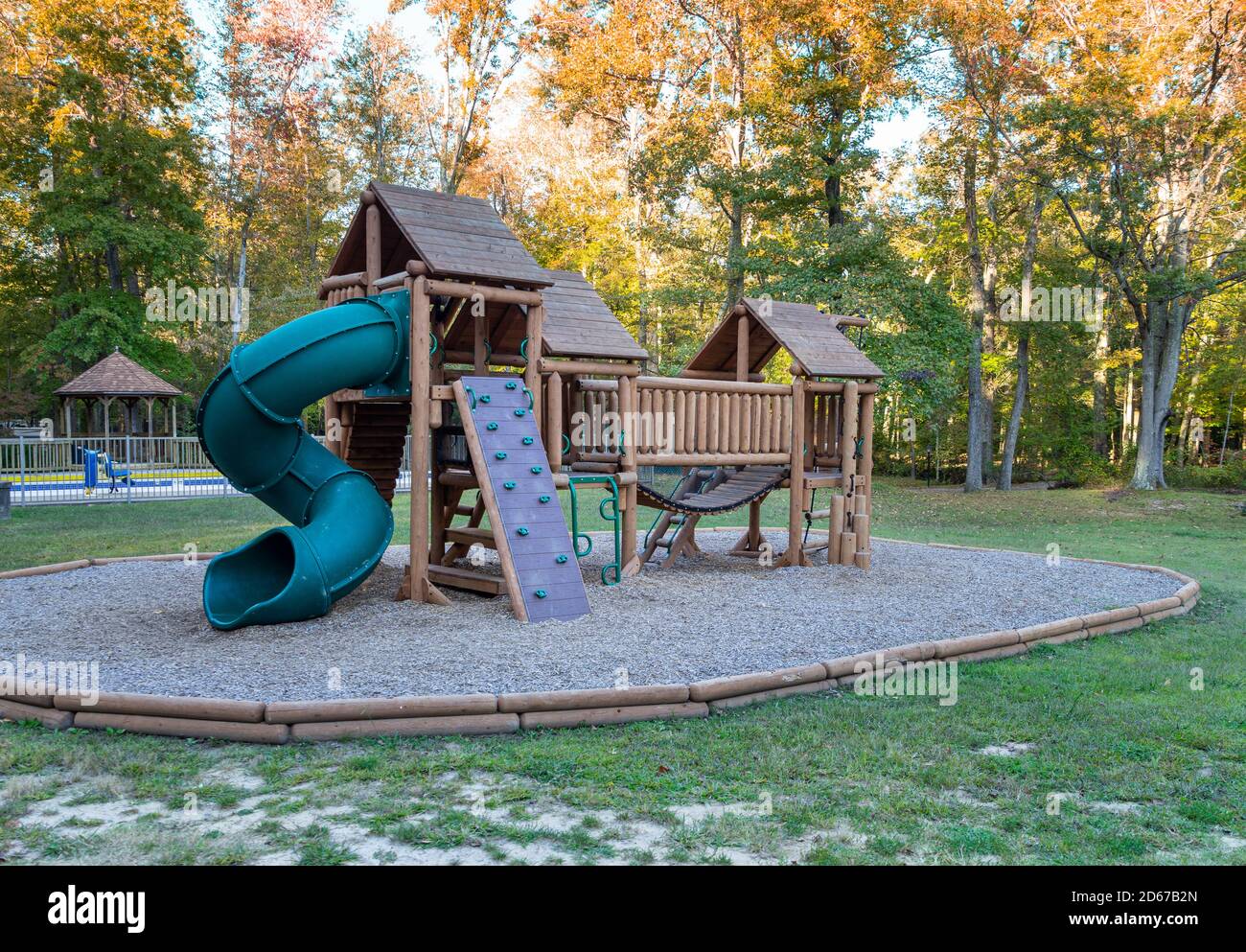 A large outdoor children's play area in a woodland setting. Stock Photo