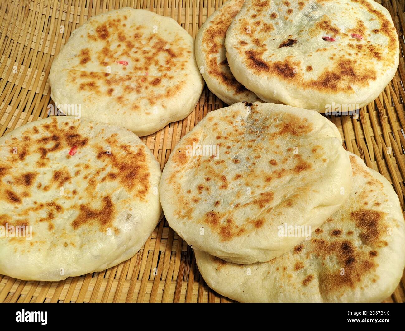 fresh baked golden pancakes on the bamboo basket for eating Stock Photo