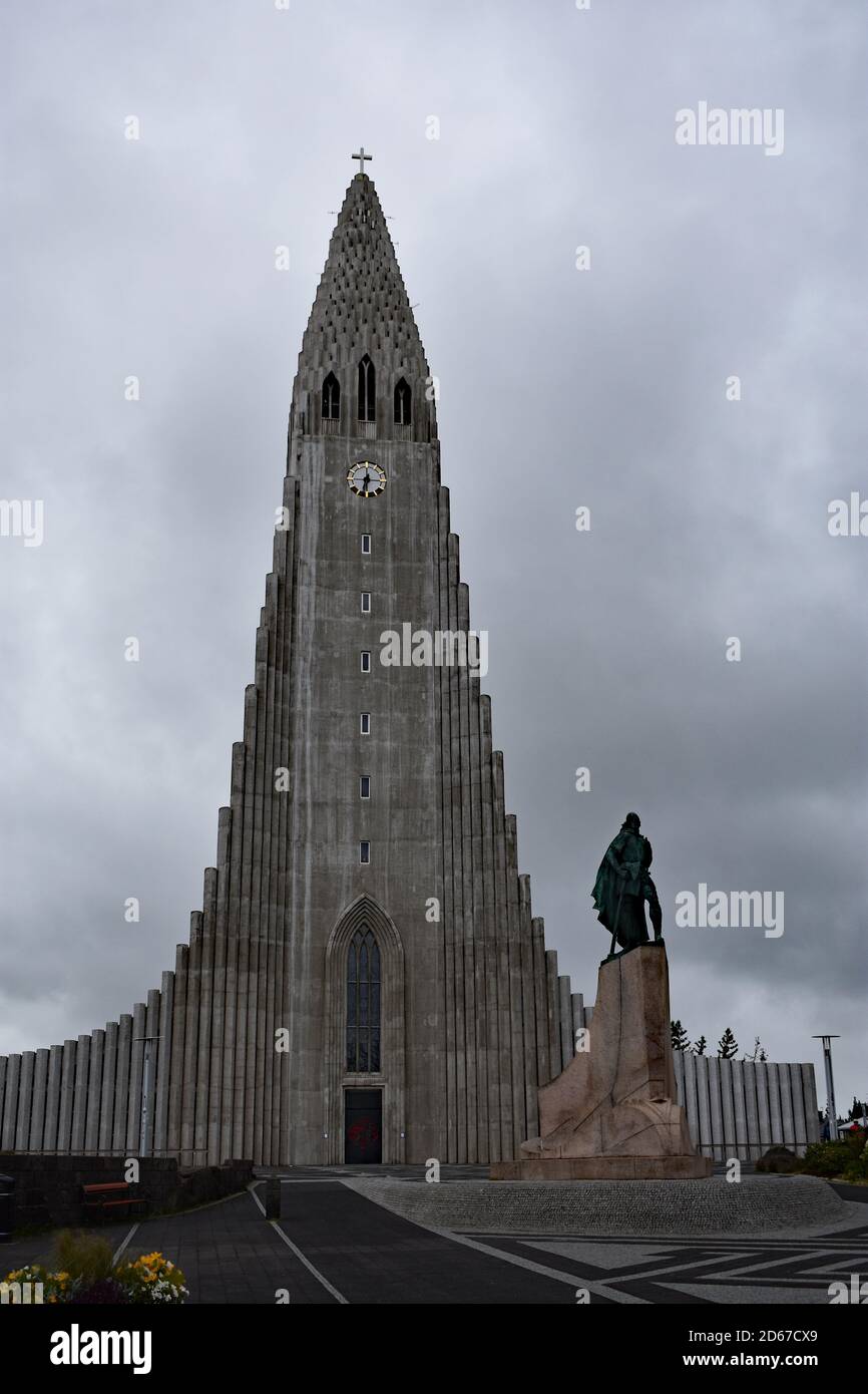 The Leif Eriksson Monument and Hallgrimskirkja Church, Reykjavik, Iceland.  Pictured on and overcast day with grey clouds and no visitors. Stock Photo