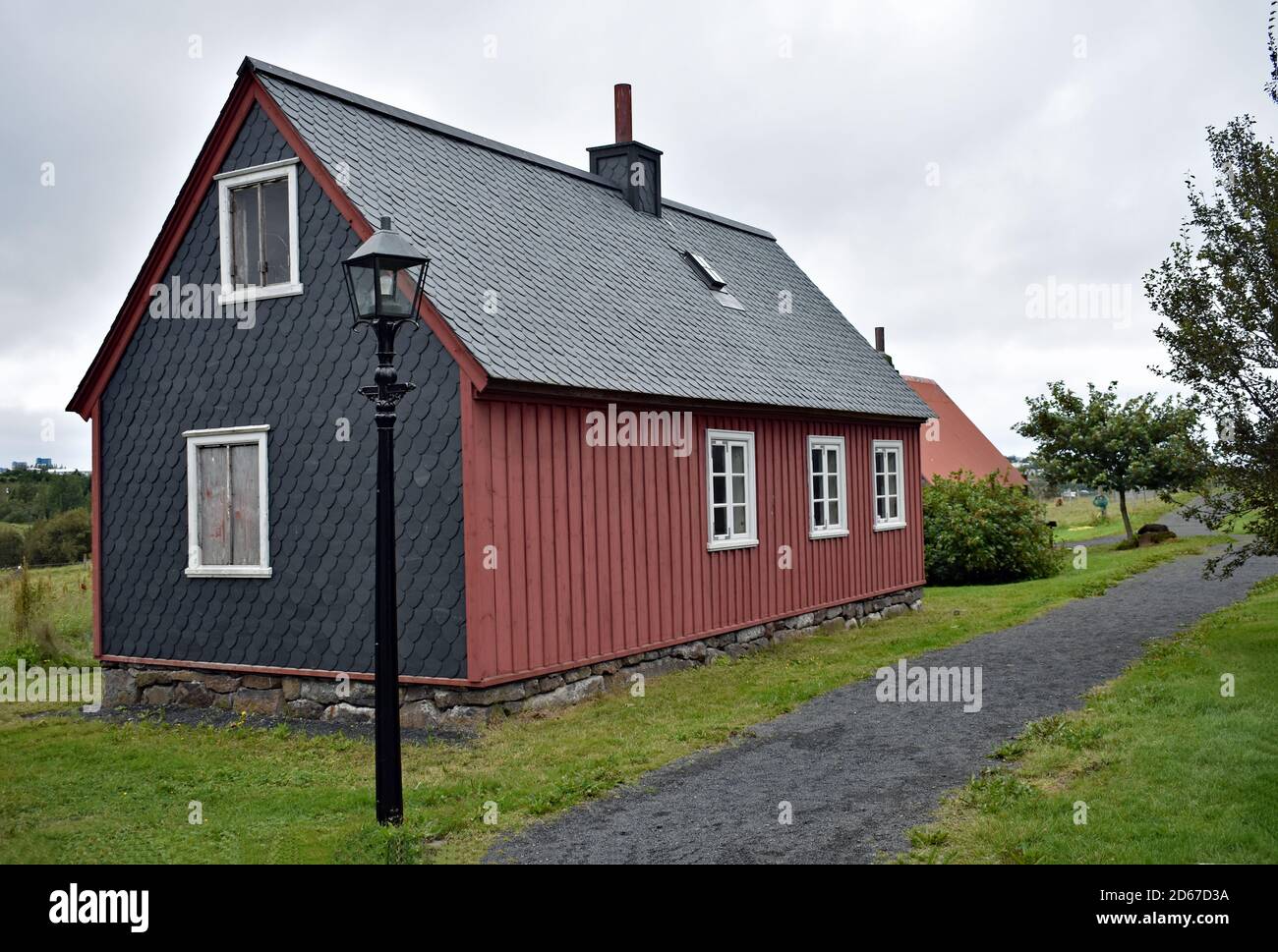 Historical Icelandic buildings, a traditional metal house with street