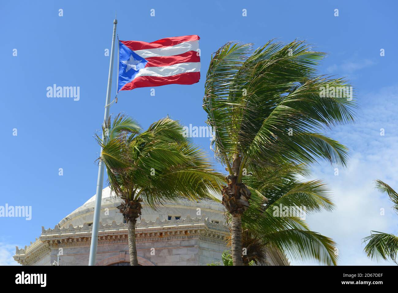 Flag of the commonwealth of puerto rico in front of capitolio san juan