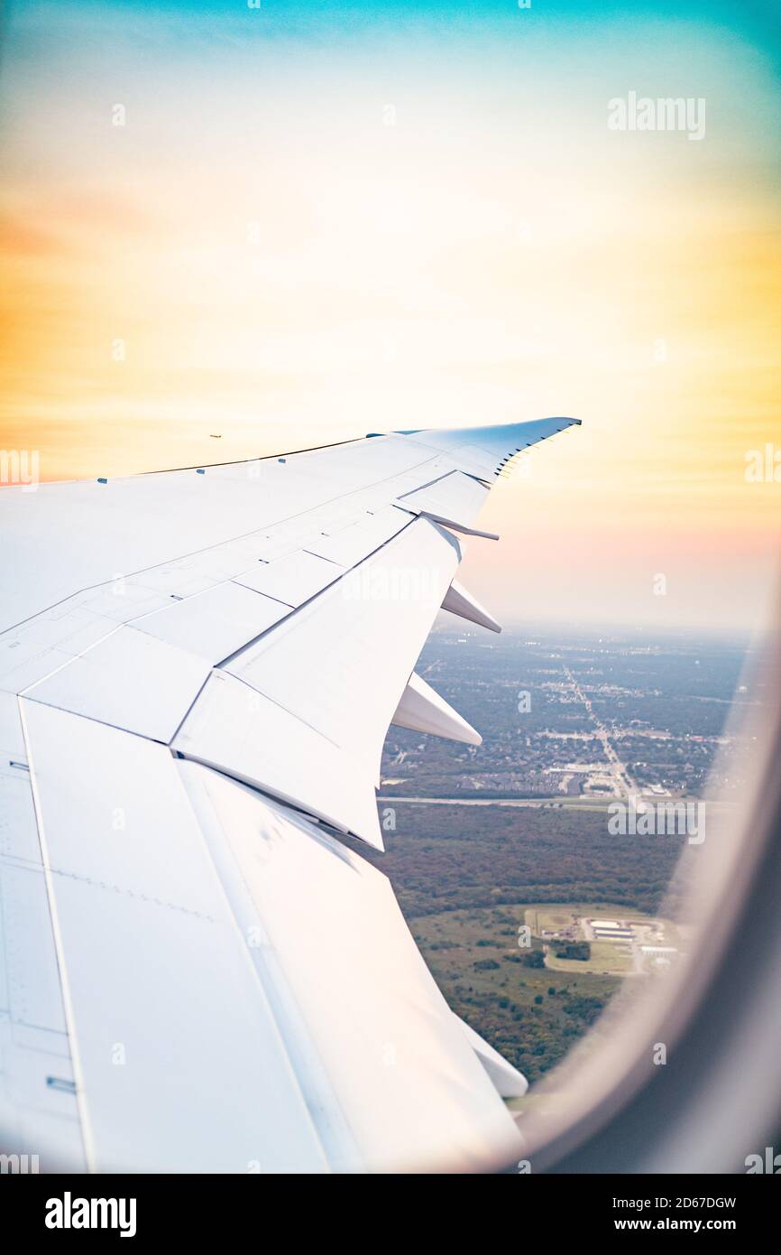 London, London, UK. 7 October 2020. Looking out the wing of an airplane.  British Airways flight from Dallas, Texas to London.  Credit: Sidney Bruere/Alamy Live Stock Photo