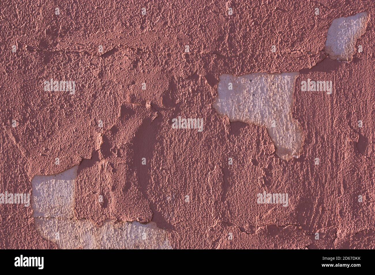 Exterior of an old house whose wall has peeling paint. Abstract background Stock Photo