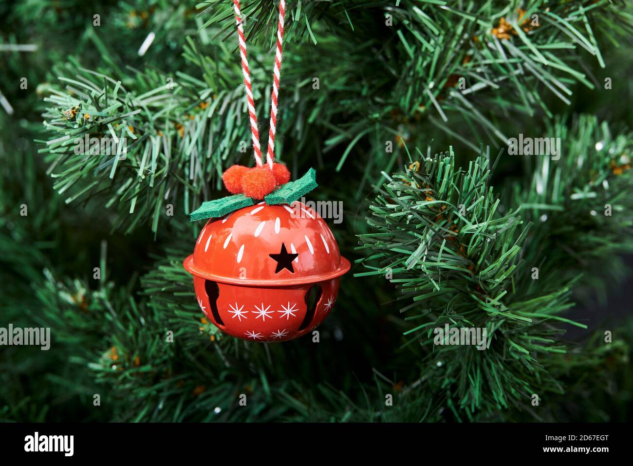 Red beautiful decorated bauble hanging from a Christmas tree, copy space Stock Photo