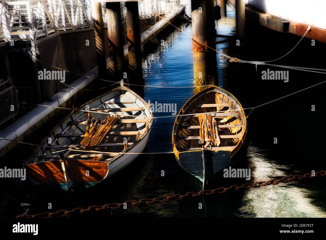 boats of different colors stand on the pier. empty boat at the pier Stock  Photo - Alamy