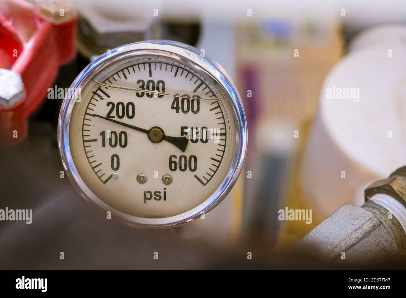 A closeup of a liquid filled analogue pressure guage Stock Photo