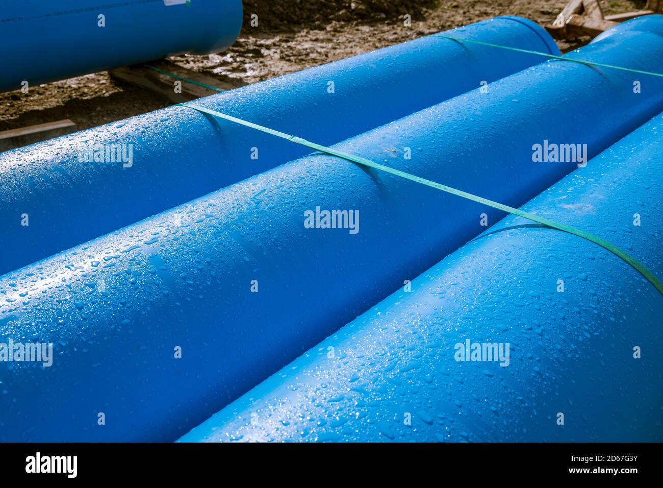 3 blue pipes with dew condensation water droplets Stock Photo Alamy