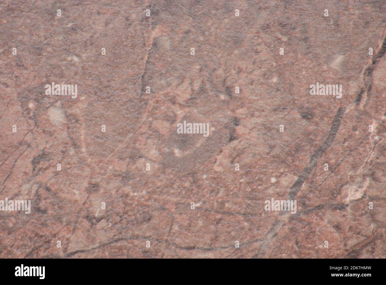 Light brown granite with black veins and blotches, large polished natural stone surface. Background, texture. Stock Photo