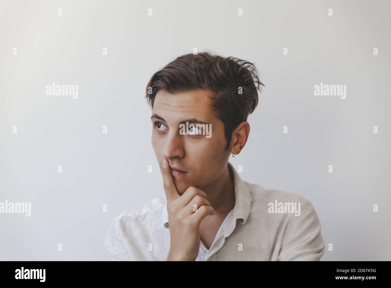 Handsome young pensive man hi-res stock photography and images - Alamy