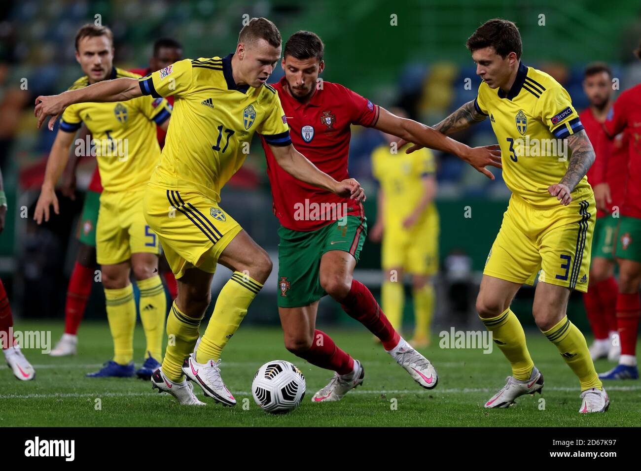 Lisbon, Portugal. 14th Oct, 2020. Viktor Claesson (front L) of Sweden vies with Ruben Dias (C) of Portugal during their UEFA Nations League football match in Lisbon, Portugal, on Oct. 14, 2020. Credit: Pedro Fiuza/Xinhua/Alamy Live News Stock Photo