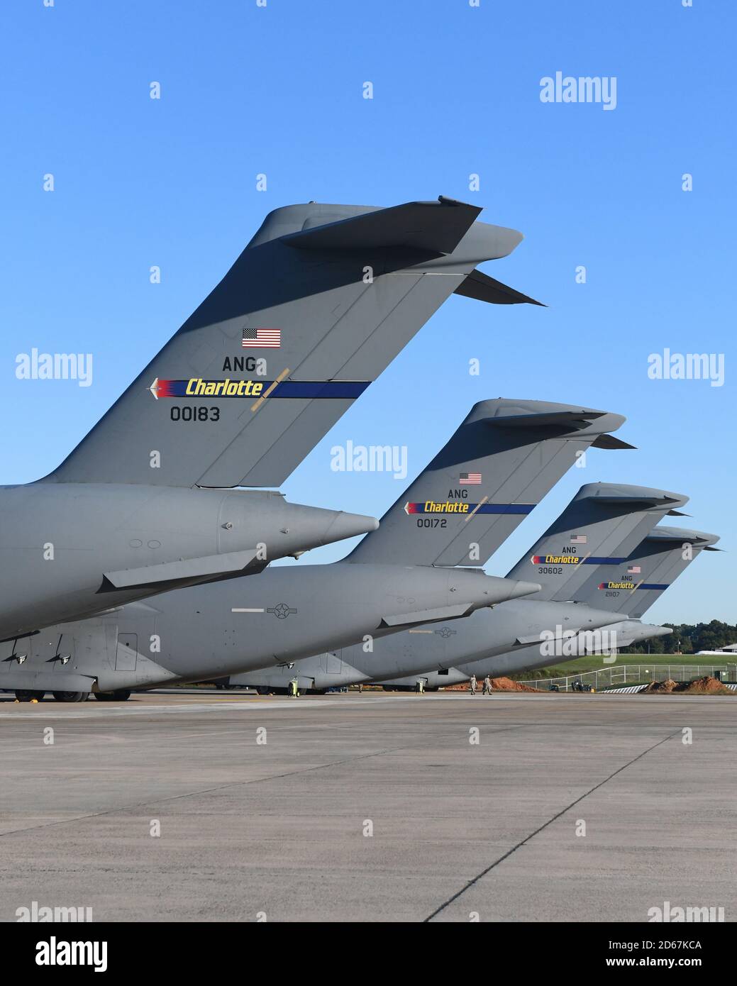 Five C-17 Globemaster III Aircraft belonging to the 145th Airlift Wing are  parked in a row on a sunny day at the North Carolina Air National Guard Base,  Charlotte Douglas International Airport,