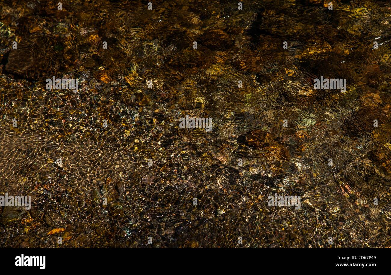 Caustic water pattern in mountain river Stock Photo