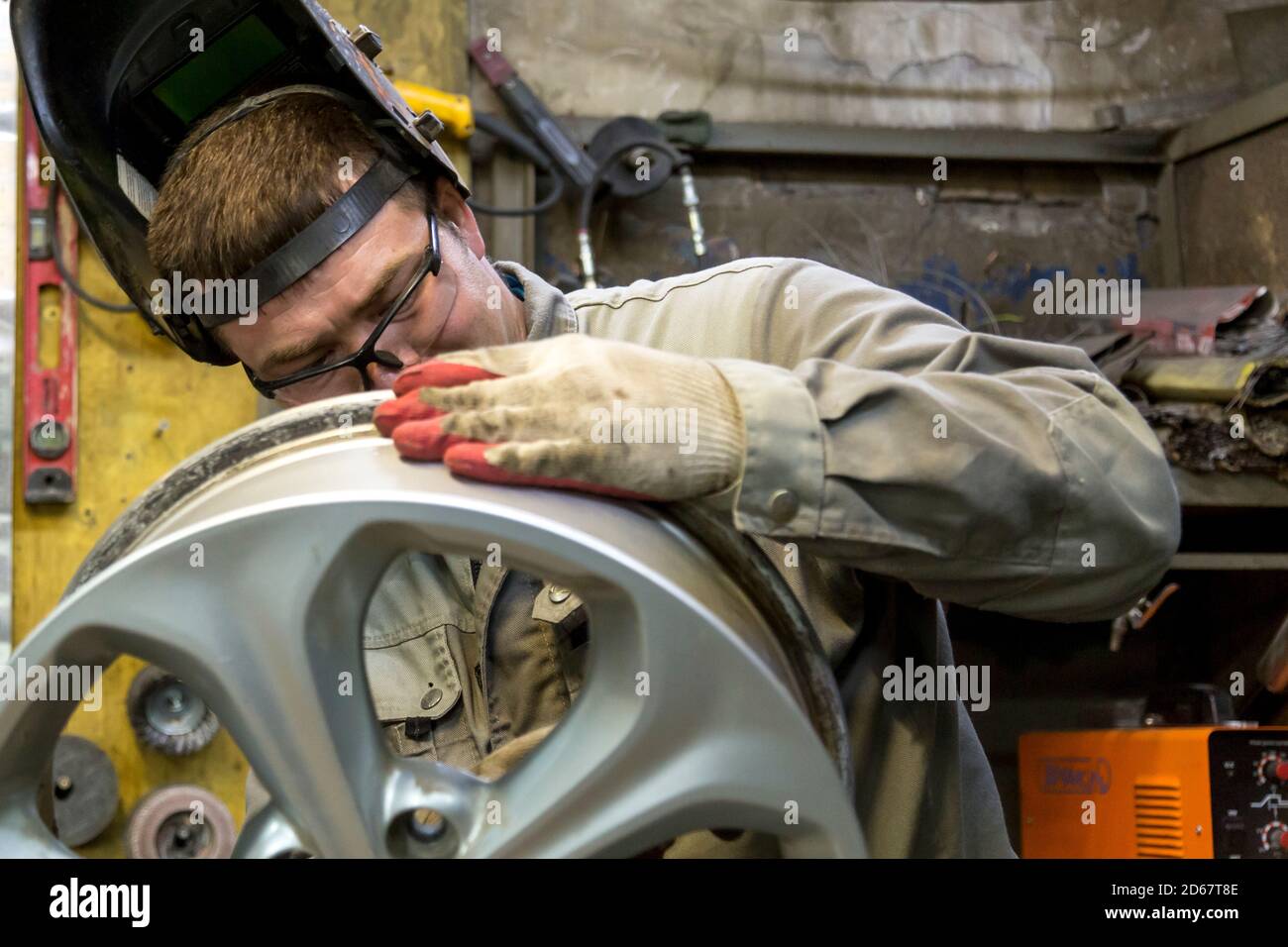 Welding a wheel rim from an aluminum car Stock Photo