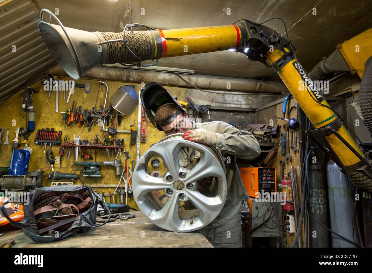 Welding a wheel rim from an aluminum car Stock Photo Alamy