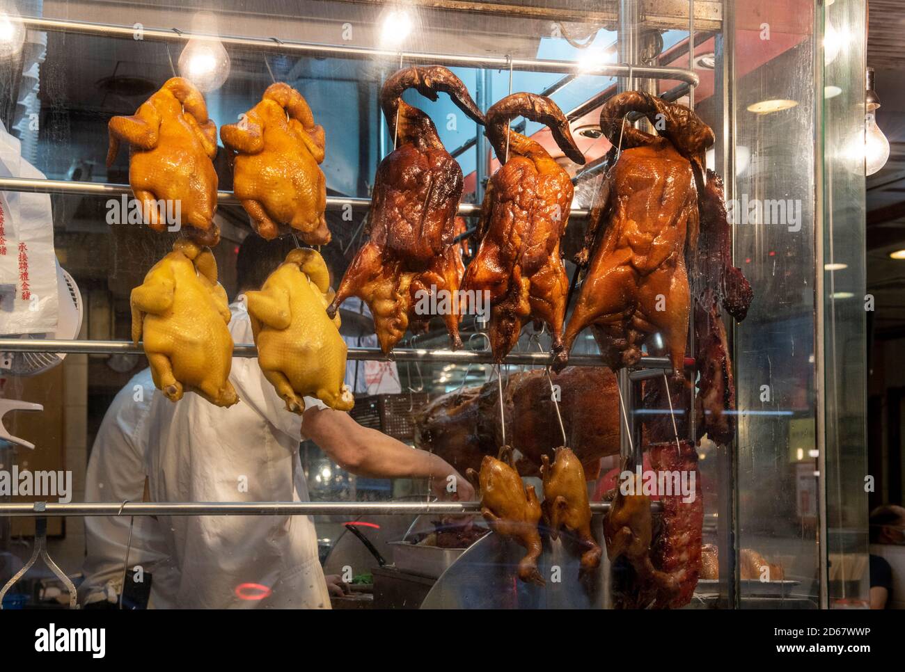 Hong Kong,China16 Aug,2020. Cantonese Hong Kong food. Cooked chickens ducks and BBQ meats hang