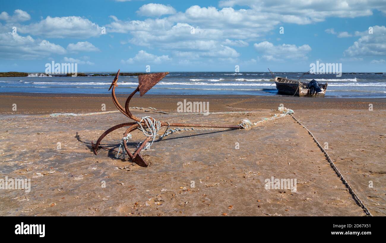 Anchor and fishing boat by the sea Stock Photo - Alamy