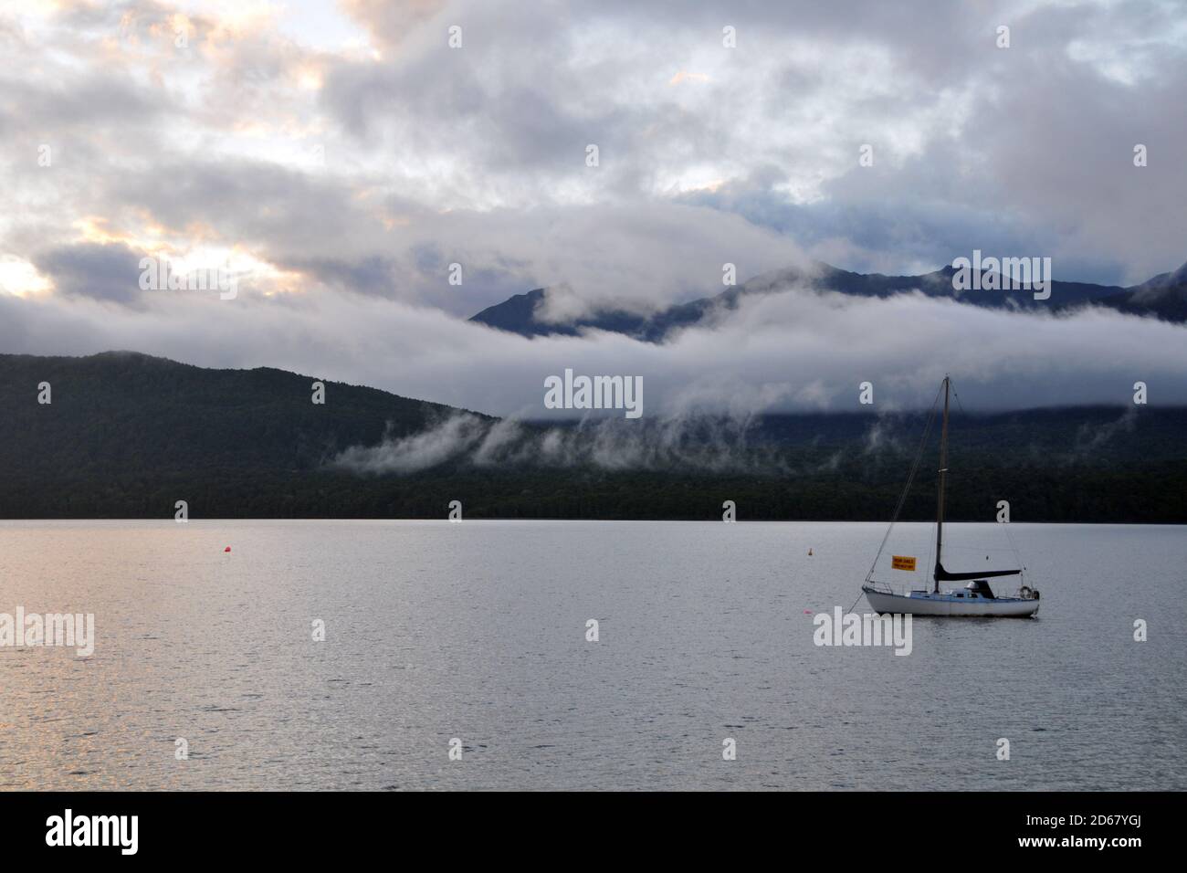 Sailboat, Lake Te Anau at dawn, South Island, New Zealand Stock Photo