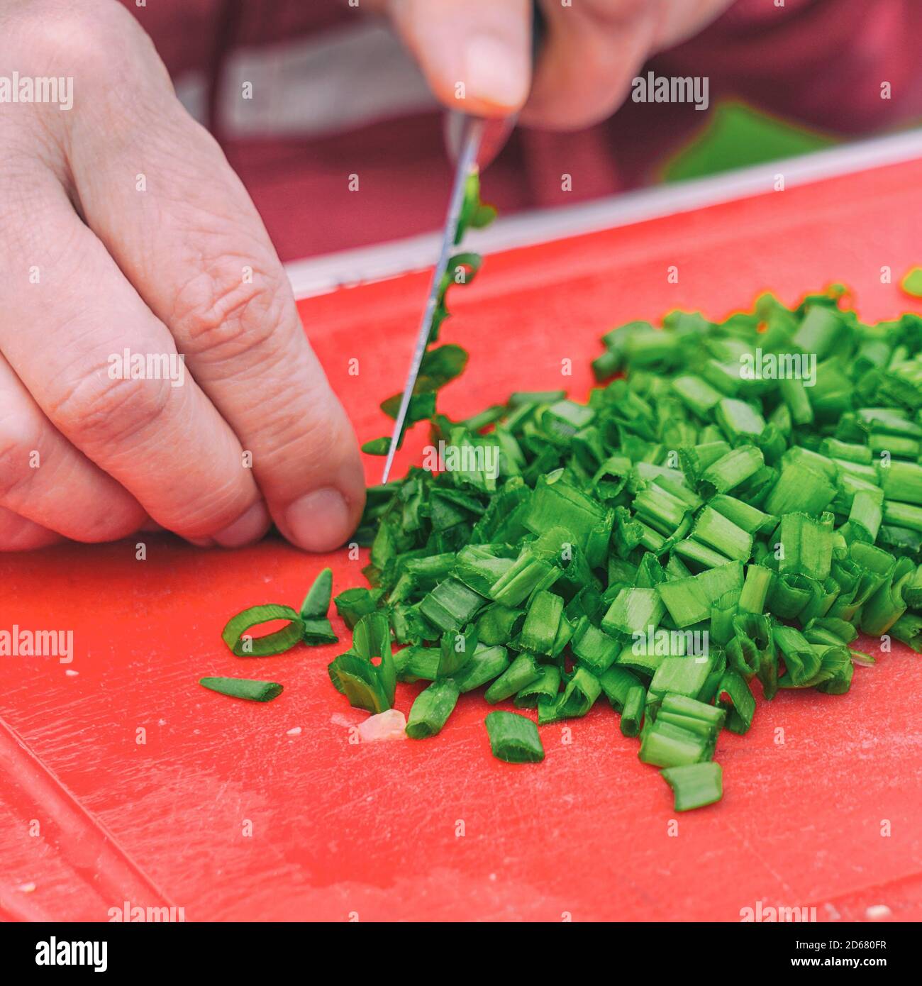 Hand knife cuts green onions hi-res stock photography and images - Alamy
