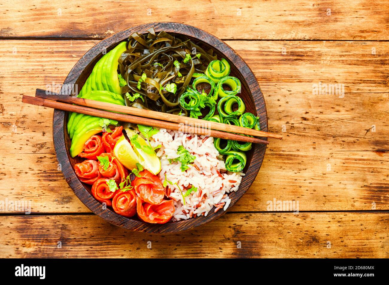 Hawaiian salmon poke bowl with rice,seaweed and avocado Stock Photo Alamy