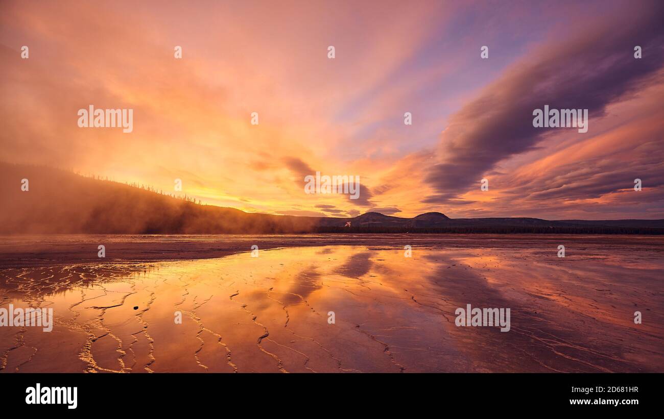 Scenic sunset at Grand Prismatic Spring in Yellowstone National Park, Wyoming, USA. Stock Photo