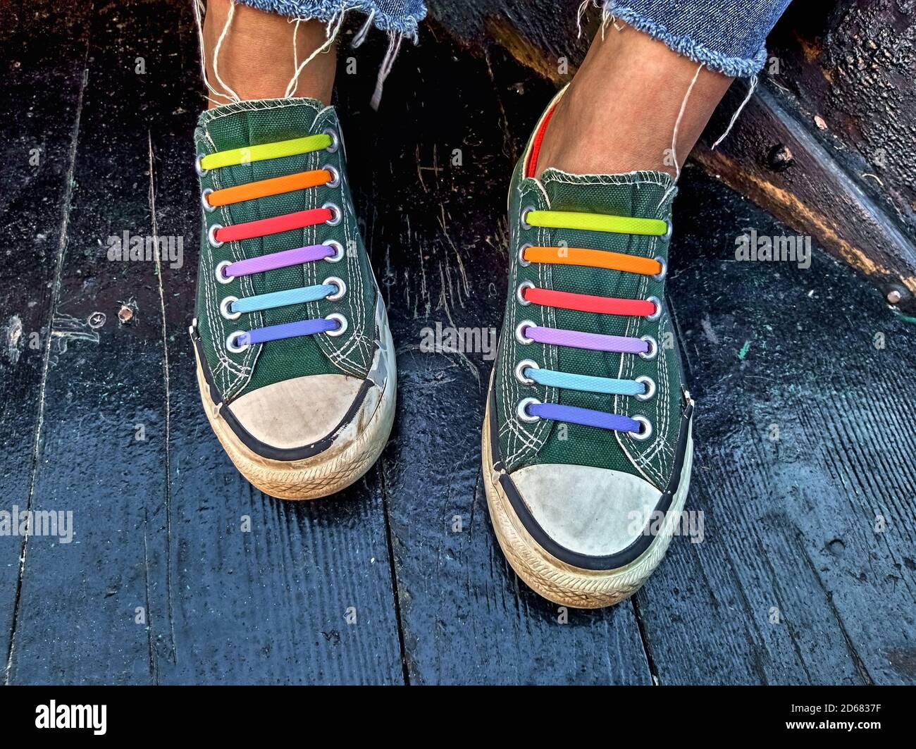 Pair of sneakers with colorful shoelaces Stock Photo Alamy