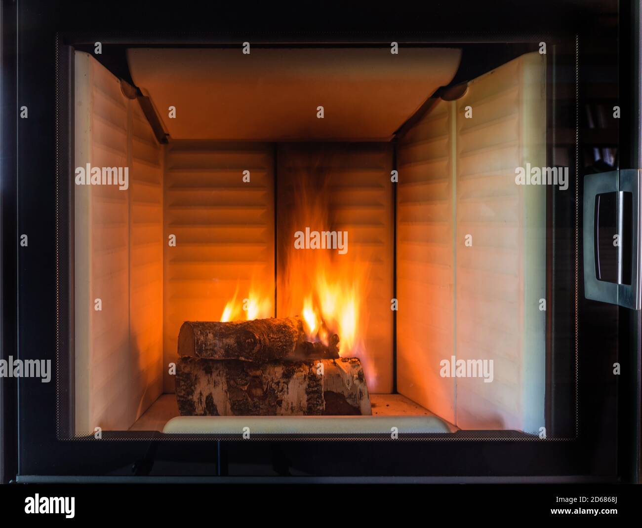 Burning fireplace. Fireplace as a piece of furniture Stock Photo Alamy