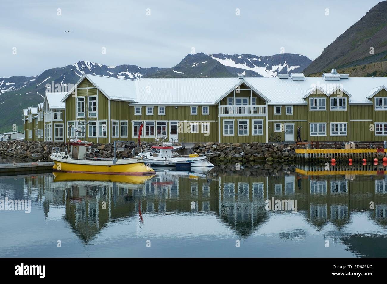 Siglo Hotel and fishing boats in the small harbour of Siglufjörður northern Iceland Stock Photo