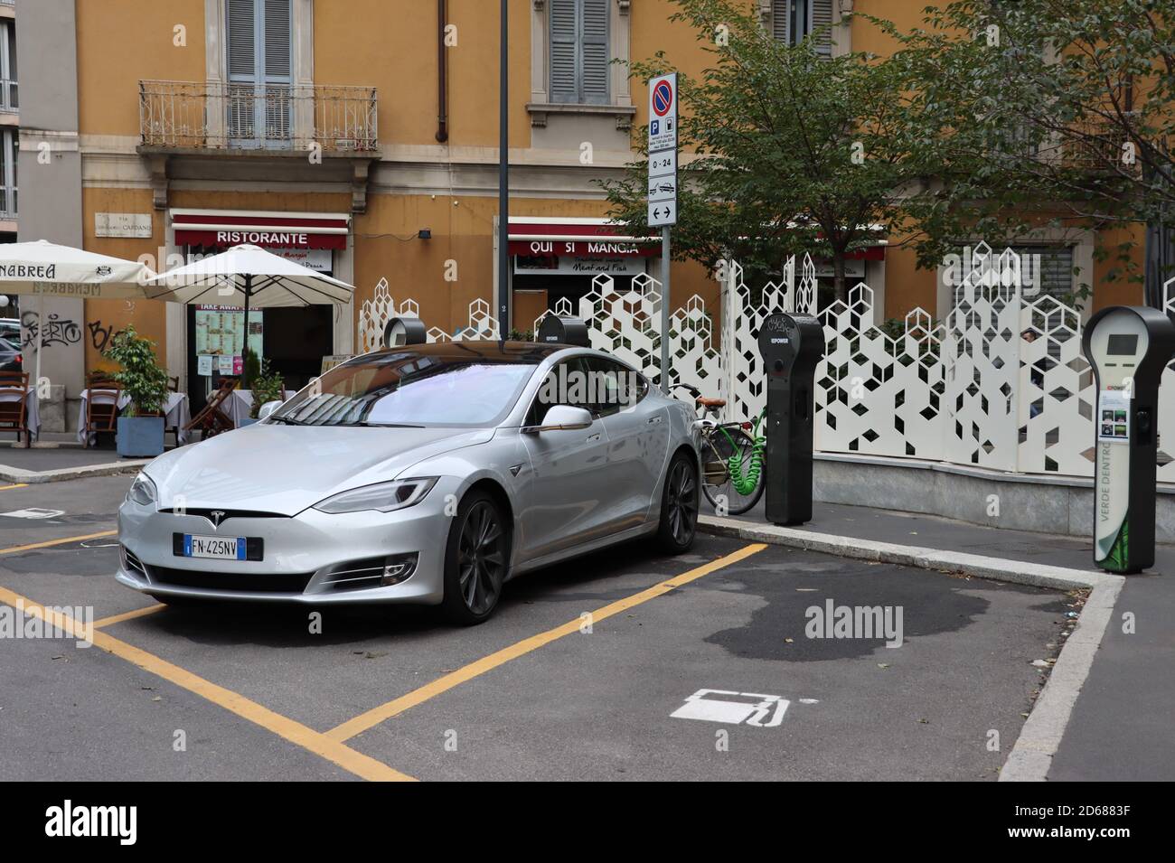 Electric vehicle on charge in Milan, Italy Stock Photo Alamy