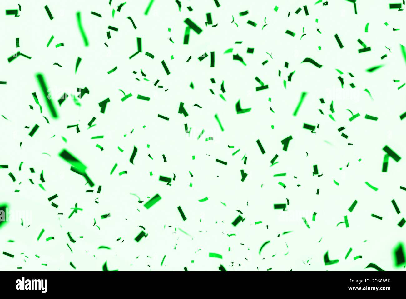 Festive background of green confetti. Template for birthday, carnival, anniversary, festival and other bright events. Party invitation Stock Photo