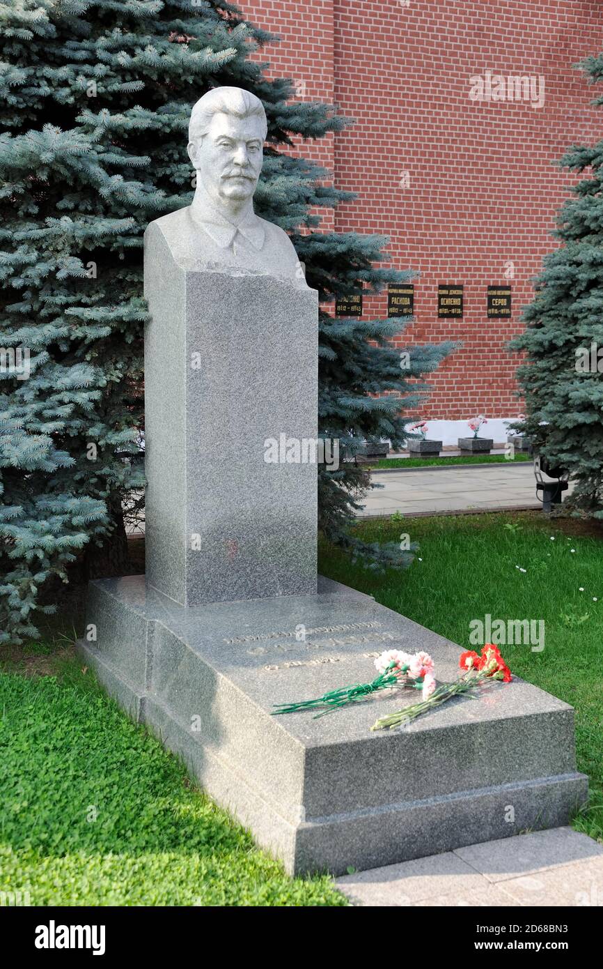 = Grave of Stalin with Carnations - Left Angled View =  Left angle view of the monument of Josef Stalin at the Kremlin Wall Necropolis on Red Square o Stock Photo