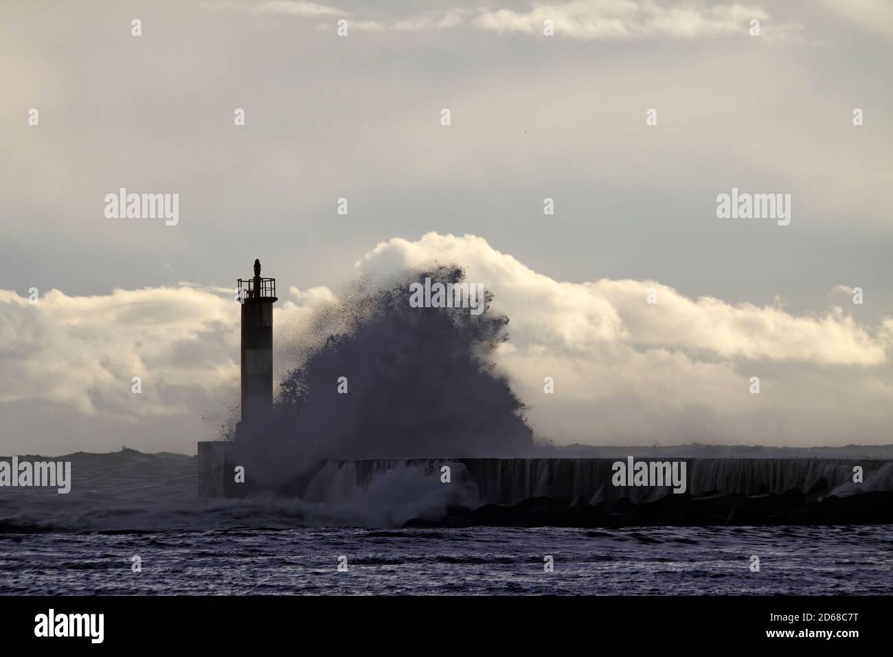 Backlit sea wave splash. Ave river mouth, Vila do Conde, north of ...