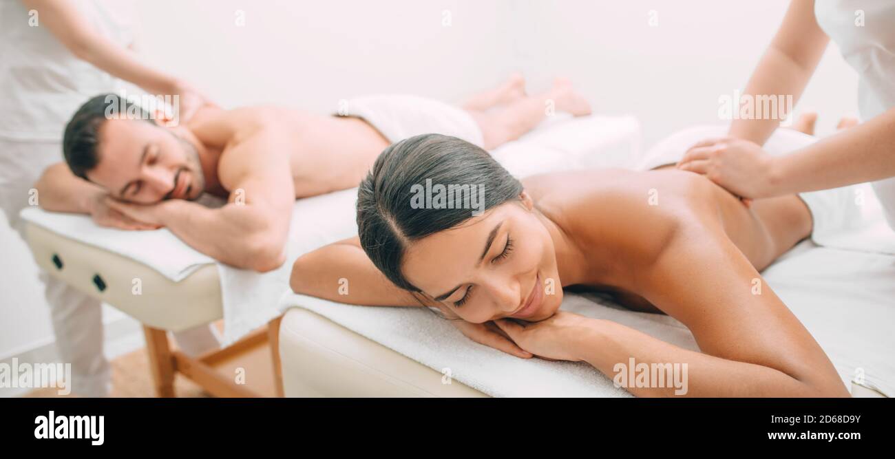 beautiful couple during back massage, joint day at the spa. Man and woman enjoy a massage Stock Photo