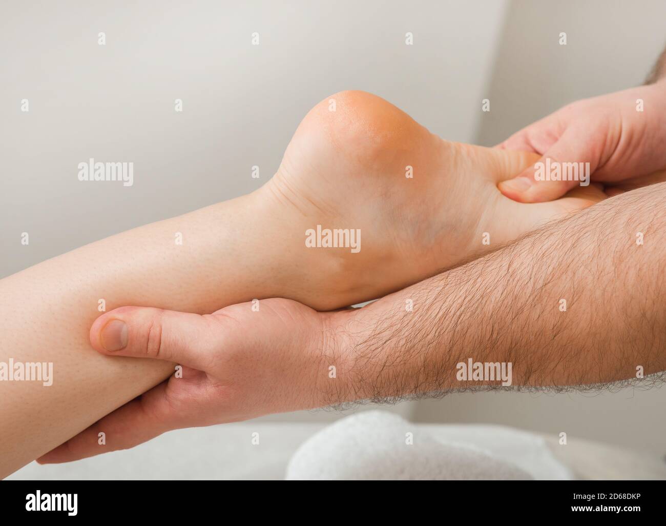 Relaxed foot massage, reflexology. Women getting foot massage, close-up Stock Photo