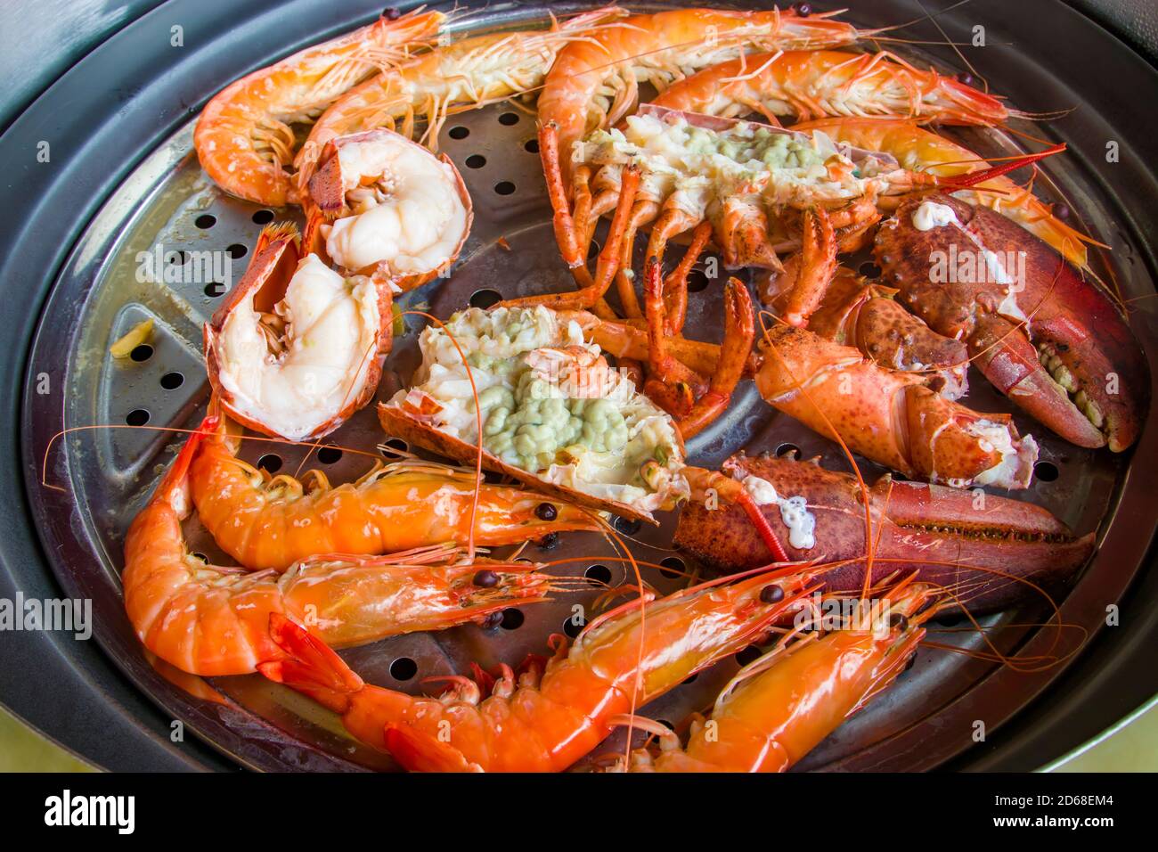 The lobster and prawns in the Steam Hotpot in Singapore Chinese