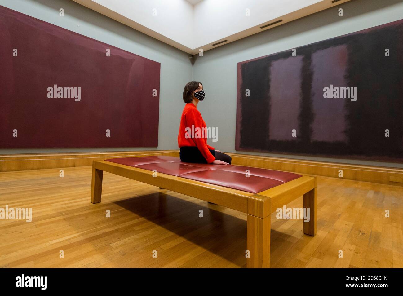 London, UK. 15 October 2020. A staff member views works 