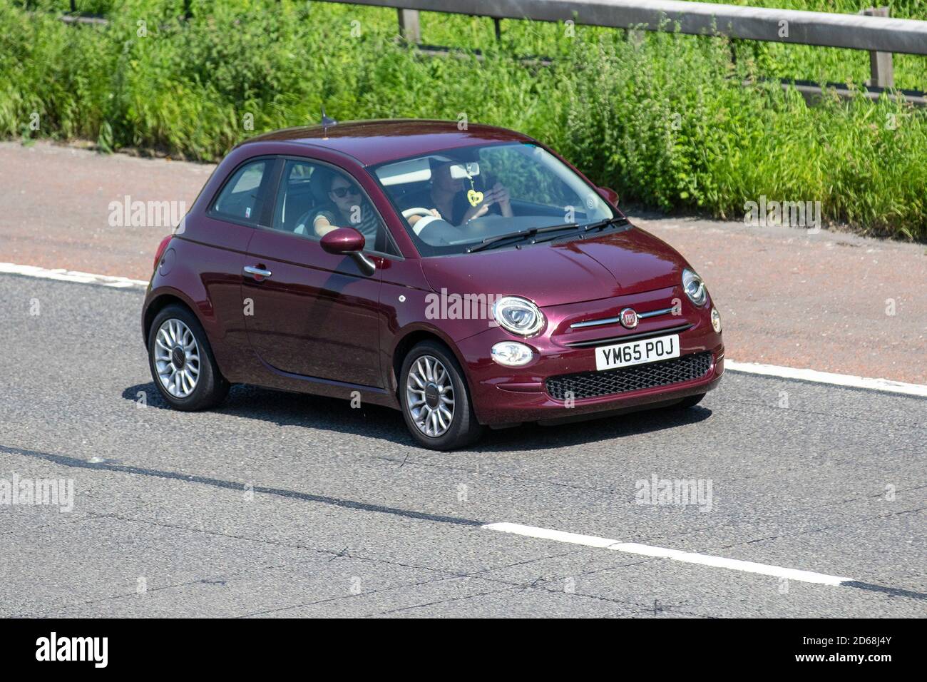 2016 red FIAT 500 HATCHBACK 1.2 Pop Star 3d; Vehicular traffic, moving vehicles, cars, vehicle driving on UK roads, motors, motoring on the M6 motorway highway UK road network. Stock Photo