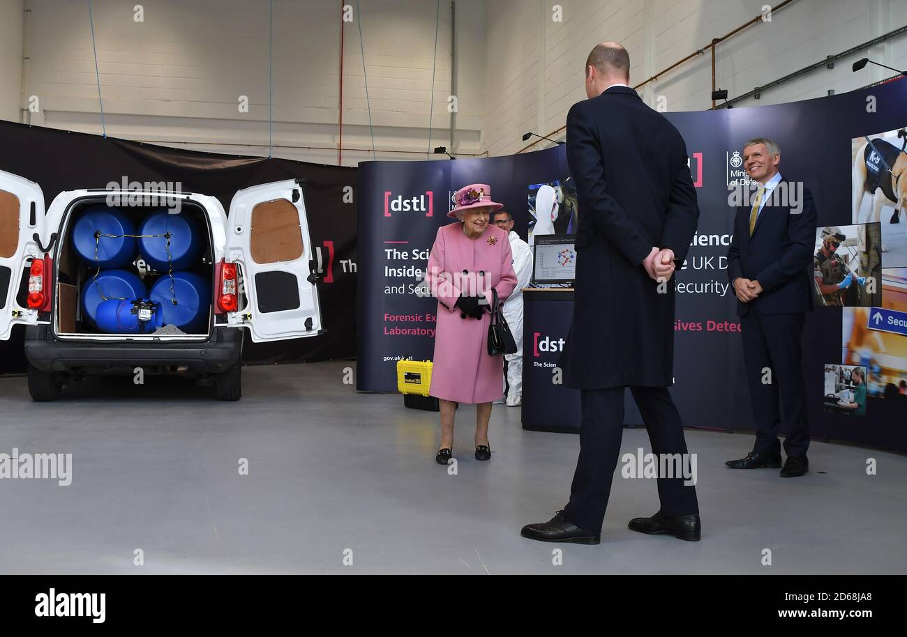 (left to right) Queen Elizabeth II, the Duke of Cambridge and Chief Executive Gary Aitkenhead view a demonstration of a Forensic Explosives Investigation, with a model explosive device in a vehicle, during a visit to the Energetics Analysis Centre of the Defence Science and Technology Laboratory (DSTL) at Porton Down, Wiltshire. Stock Photo