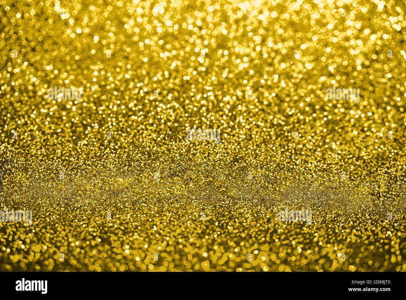 Yellow bokeh background.Christmas, New Year's eve, party, celebration concept. Illuminating color. Stock Photo
