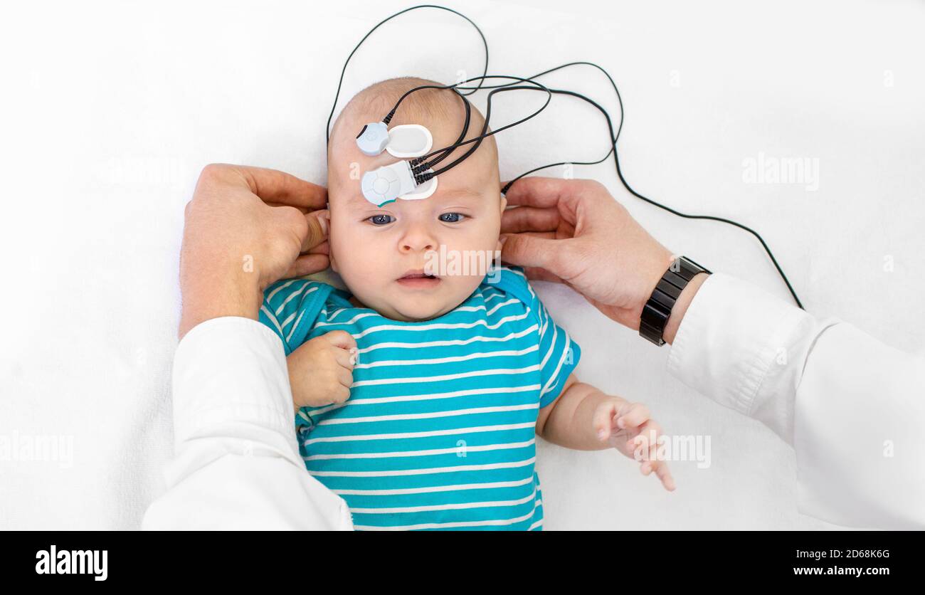 Newborn hearing screening and diagnosis at the hospital. Baby having