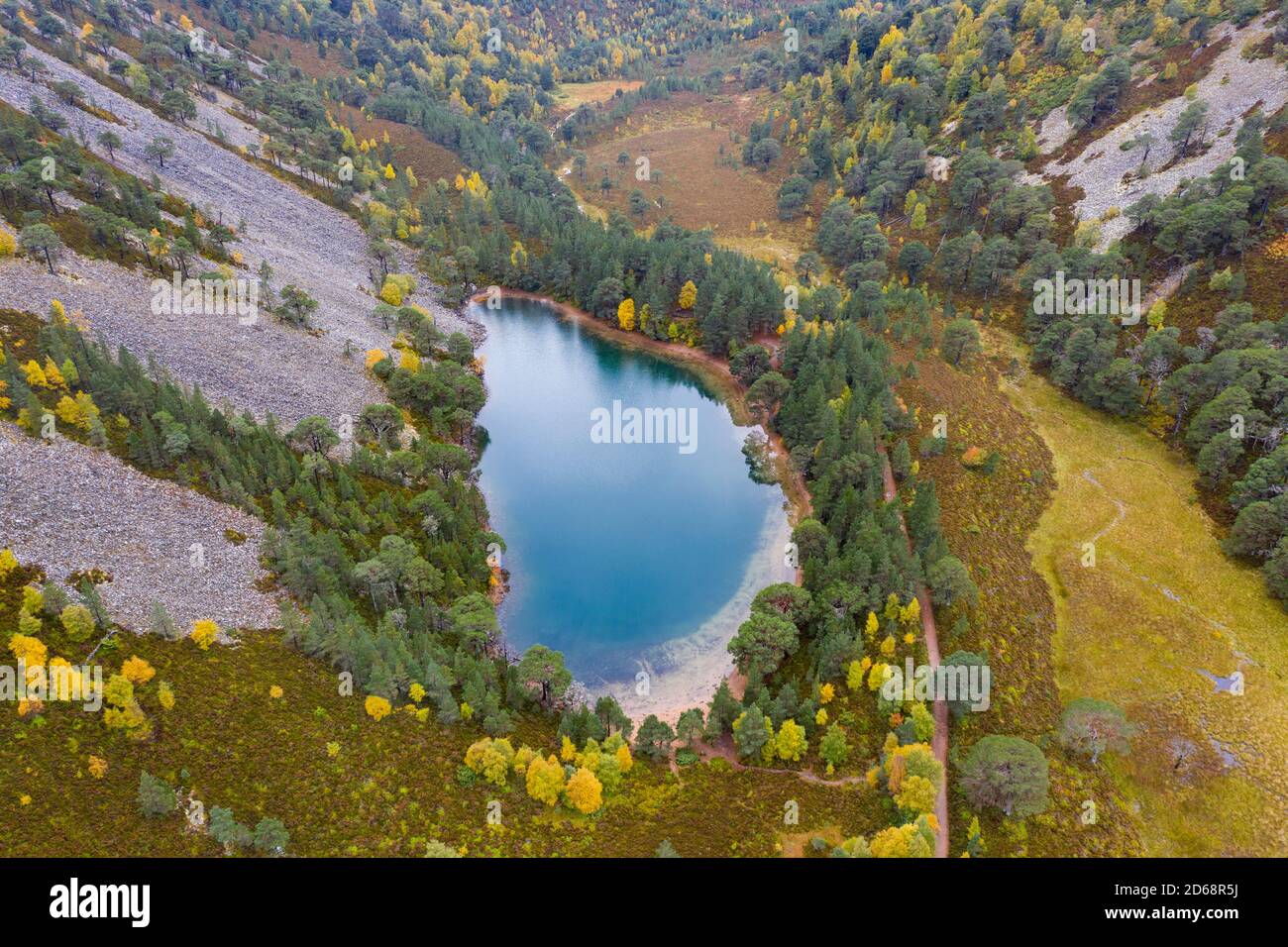 Autumn aerial view of An Lochan Uaine  (Green Loch) due to the striking green colour of it's water in Cairngorms National Park, Scotland,UK Stock Photo
