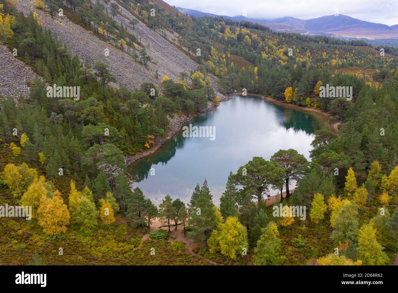 Autumn aerial view of An Lochan Uaine  (Green Loch) due to the striking green colour of it's water in Cairngorms National Park, Scotland,UK Stock Photo
