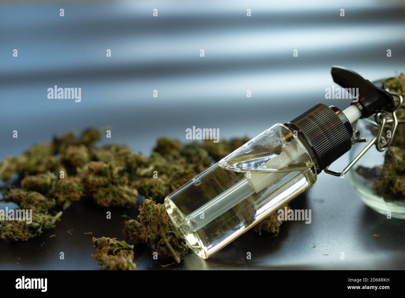 CBD hemp oil with marijuana, copy space design background. Backdrop with cannabis. THC weed Stock Photo
