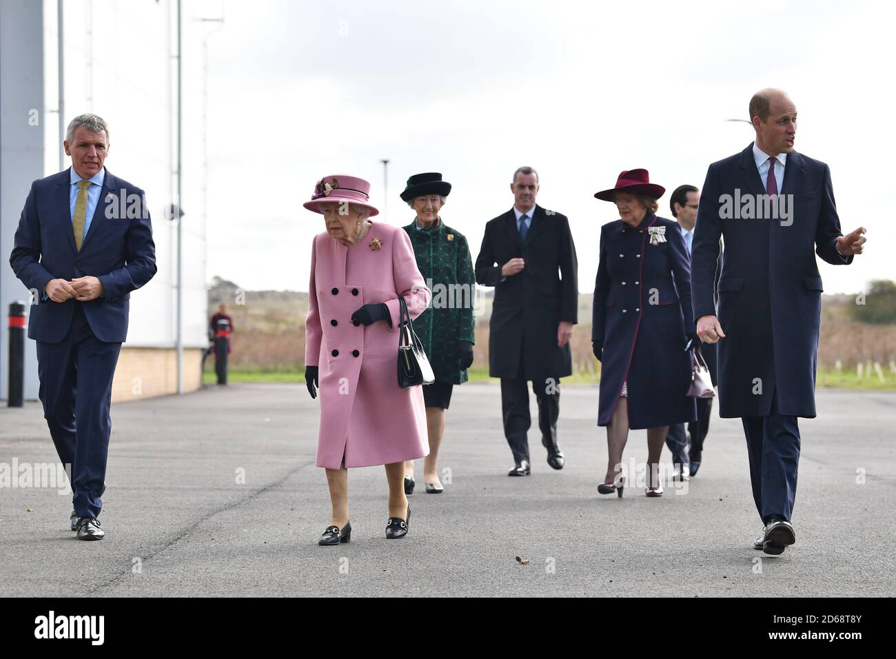 (left to right) Chief Executive Gary Aitkenhead, Queen Elizabeth II and the Duke of Cambridge arrive for a visit to the Energetics Analysis Centre at the Defence Science and Technology Laboratory (DSTL) at Porton Down, Wiltshire. Stock Photo