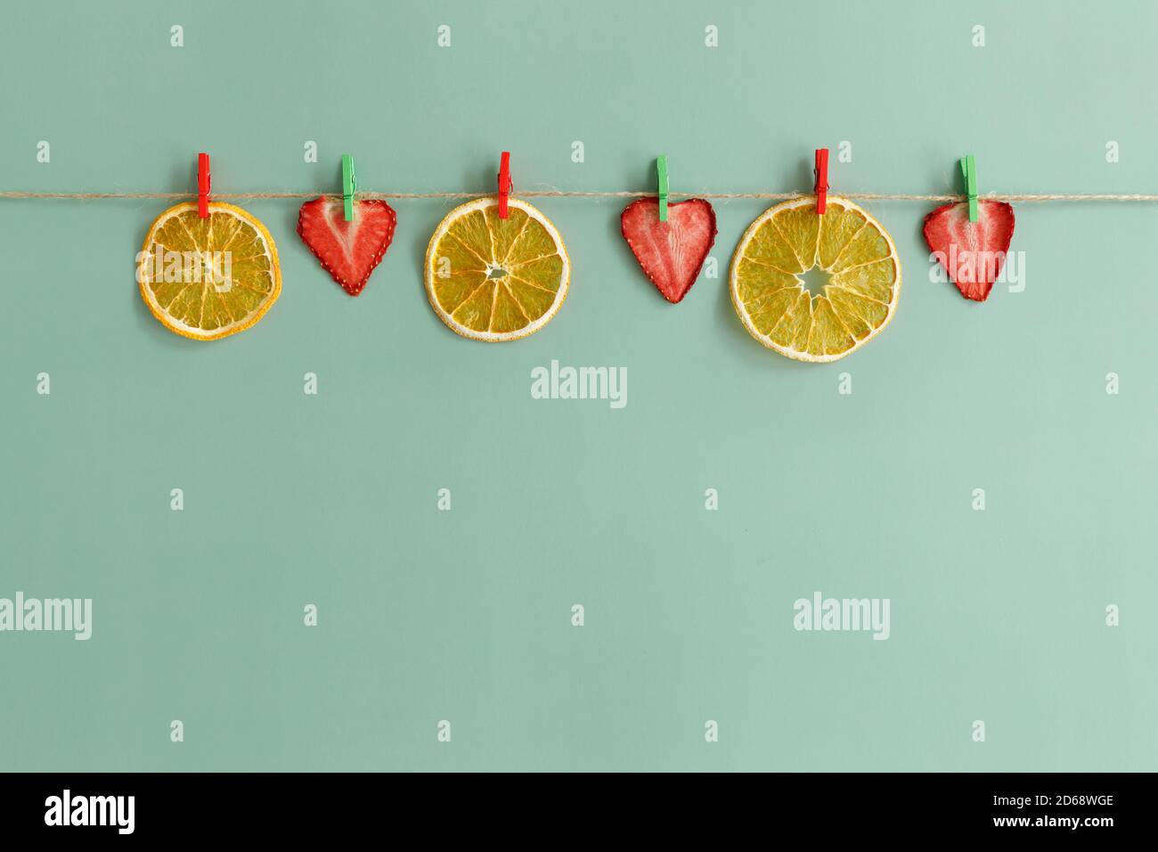 Fruit chips are dried on a rope. Healthy snacks for people who lead a ...