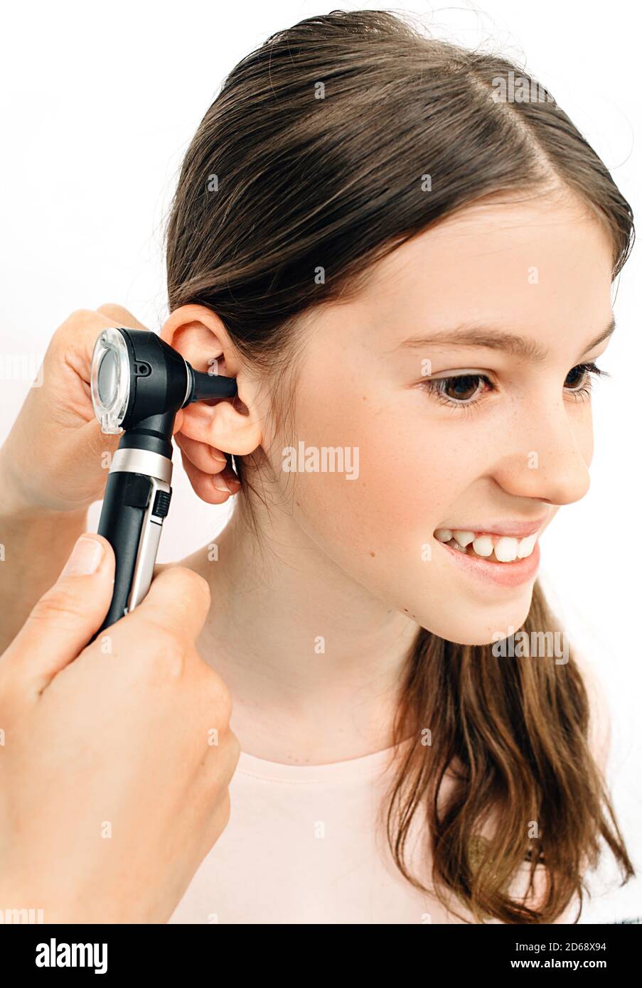Child hearing exam. Diagnosis of impairment and hearing testing in children. Girl during an ear checkup with an audiologist Stock Photo